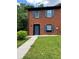 Charming brick townhouse featuring blue shutters and a neatly maintained front lawn at 1001 Park Gate Pl, Stone Mountain, GA 30083