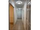 Hallway featuring tile floors and white paint with multiple rooms at 1001 Park Gate Pl, Stone Mountain, GA 30083