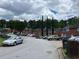 Street view showing multiple townhomes and ample parking on a cloudy day at 1001 Park Gate Pl, Stone Mountain, GA 30083