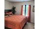 Bedroom with cozy bed and window with decorative curtains at 110 Halibut Cir, Covington, GA 30016