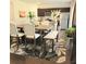 Stylish dining room with a wooden table, padded chairs, and a view into the open-plan kitchen area at 110 Halibut Cir, Covington, GA 30016