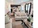Open-concept living room with modern decor and kitchen view at 110 Halibut Cir, Covington, GA 30016