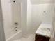 Functional bathroom featuring a shower-tub combination, single sink vanity, and simple design at 1177 Arlington Sw Ave, Atlanta, GA 30310