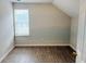 Bedroom with wood-look floors and a window, creating a comfortable space at 1177 Arlington Sw Ave, Atlanta, GA 30310