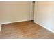 Light-filled bedroom with wood-look floors and access to a closet or bathroom at 1177 Arlington Sw Ave, Atlanta, GA 30310