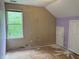 Bedroom showcasing renovation potential, with sloped ceilings and bare floors ready for transformation at 1177 Arlington Sw Ave, Atlanta, GA 30310