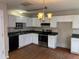 Functional kitchen equipped with stainless steel appliances, ample counter space, and classic white cabinetry at 1177 Arlington Sw Ave, Atlanta, GA 30310