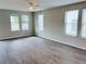 Bright living room featuring modern flooring and large windows that flood the space with plenty of natural light at 1177 Arlington Sw Ave, Atlanta, GA 30310
