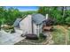 Aerial view of the home showing the spacious backyard, landscaping and proximity to nature at 1235 Legend Run, Alpharetta, GA 30005