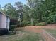 Picture of a backyard featuring terraced landscaping with lush greenery and privacy from mature trees at 1235 Legend Run, Alpharetta, GA 30005
