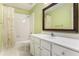 Cozy bathroom with white cabinets, a large mirror, and a shower and tub combination at 1235 Legend Run, Alpharetta, GA 30005