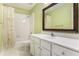 Well-lit bathroom features a large mirror, white cabinets, and shower with curtain at 1235 Legend Run, Alpharetta, GA 30005