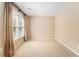 Bedroom featuring neutral walls, carpeted floors, a window with curtains, and a ceiling fan at 1235 Legend Run, Alpharetta, GA 30005