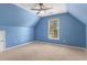 Bedroom with blue walls, a window, and ceiling fan at 1235 Legend Run, Alpharetta, GA 30005