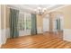 Bright dining area featuring elegant chandelier and hardwood floors at 1235 Legend Run, Alpharetta, GA 30005