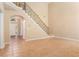 Spacious foyer with tile floors, staircase, and arched doorway, offering an inviting entrance at 1235 Legend Run, Alpharetta, GA 30005