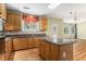 Well-equipped kitchen features stainless appliances, granite counters, wood cabinets, and center island at 1235 Legend Run, Alpharetta, GA 30005