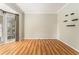 Bright living room with natural light from the windows, hardwood floors, and crown molding at 1235 Legend Run, Alpharetta, GA 30005