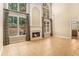 Living room with fireplace, two-story windows, and tile flooring at 1235 Legend Run, Alpharetta, GA 30005