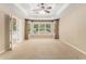 Spacious main bedroom with bay window, tray ceiling, and plush carpeting at 1235 Legend Run, Alpharetta, GA 30005