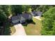 Gorgeous aerial shot displays beautiful lawns and lovely homes surrounded by lush greenery at 65 Ashland Farm Rd, Oxford, GA 30054