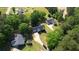 Expansive aerial view of the lovely homes surrounded by verdant trees on a sunny day at 65 Ashland Farm Rd, Oxford, GA 30054