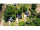 Aerial view showing the property's boundaries, surrounded by trees and neighboring homes at 65 Ashland Farm Rd, Oxford, GA 30054