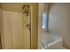 Corner of a bathroom featuring a shower and bathtub at 65 Ashland Farm Rd, Oxford, GA 30054