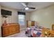 Comfortable bedroom with natural light and ceiling fan at 65 Ashland Farm Rd, Oxford, GA 30054