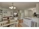 Inviting dining area features a wood table with seating for four, and lovely decor accents at 65 Ashland Farm Rd, Oxford, GA 30054