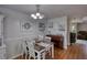 Bright dining area featuring an oak dining table and decor, plus a mahogany upright piano at 65 Ashland Farm Rd, Oxford, GA 30054