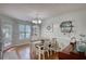 Cozy dining area with a table, chairs, and a hutch for storage and display at 65 Ashland Farm Rd, Oxford, GA 30054