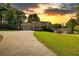 Charming single-Gathering home with a sprawling front yard and a long, curved driveway at 65 Ashland Farm Rd, Oxford, GA 30054