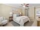 Bedroom with ceiling fan, neutral colors and bright light from the window at 66 Devon Ln, Avondale Estates, GA 30002
