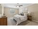 Comfortable bedroom with a ceiling fan, soft carpet and a large area rug at 66 Devon Ln, Avondale Estates, GA 30002