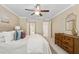 Bedroom with ceiling fan, neutral colors, adjacent to a bathroom and hallway at 66 Devon Ln, Avondale Estates, GA 30002