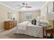 Relaxing bedroom with a ceiling fan, soft carpet, and neutral colors at 66 Devon Ln, Avondale Estates, GA 30002