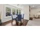 Cozy dining area with hardwood floors, fireplace, and view of the outdoors at 66 Devon Ln, Avondale Estates, GA 30002