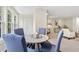 Bright dining area featuring wood floors, neutral walls, and comfortable blue chairs at 66 Devon Ln, Avondale Estates, GA 30002