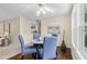 Charming dining area with wood floors and ample natural light from large windows at 66 Devon Ln, Avondale Estates, GA 30002