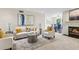 Elegant living room with fireplace, comfortable seating, and open view to the dining area at 66 Devon Ln, Avondale Estates, GA 30002