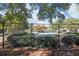 Community pool surrounded by lush greenery and a secure fence at 66 Devon Ln, Avondale Estates, GA 30002