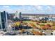 Stunning aerial view of the city skyline with Ferris wheel and green space in the foreground on a sunny day at 90 Fairlie Street Nw #801 # 801, Atlanta, GA 30303
