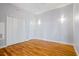 Bright bedroom features hardwood floors, neutral walls, and a closet at 90 Fairlie Street Nw #801 # 801, Atlanta, GA 30303