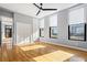 Bedroom with hardwood floors, a closet, and three windows at 90 Fairlie Street Nw #801 # 801, Atlanta, GA 30303