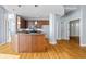 Open kitchen featuring an island, hardwood floors, and modern appliances at 90 Fairlie Street Nw #801 # 801, Atlanta, GA 30303