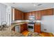 Kitchen with wood cabinets, stainless steel appliances, and granite countertops at 90 Fairlie Street Nw #801 # 801, Atlanta, GA 30303