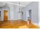 Open-concept living room with hardwood floors and a decorative chandelier at 90 Fairlie Street Nw #801 # 801, Atlanta, GA 30303