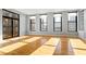 Spacious living room with hardwood floors and multiple windows offering natural light at 90 Fairlie Street Nw #801 # 801, Atlanta, GA 30303
