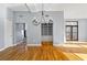 Bright living room featuring hardwood floors, built-in shelving, and a decorative chandelier at 90 Fairlie Street Nw #801 # 801, Atlanta, GA 30303